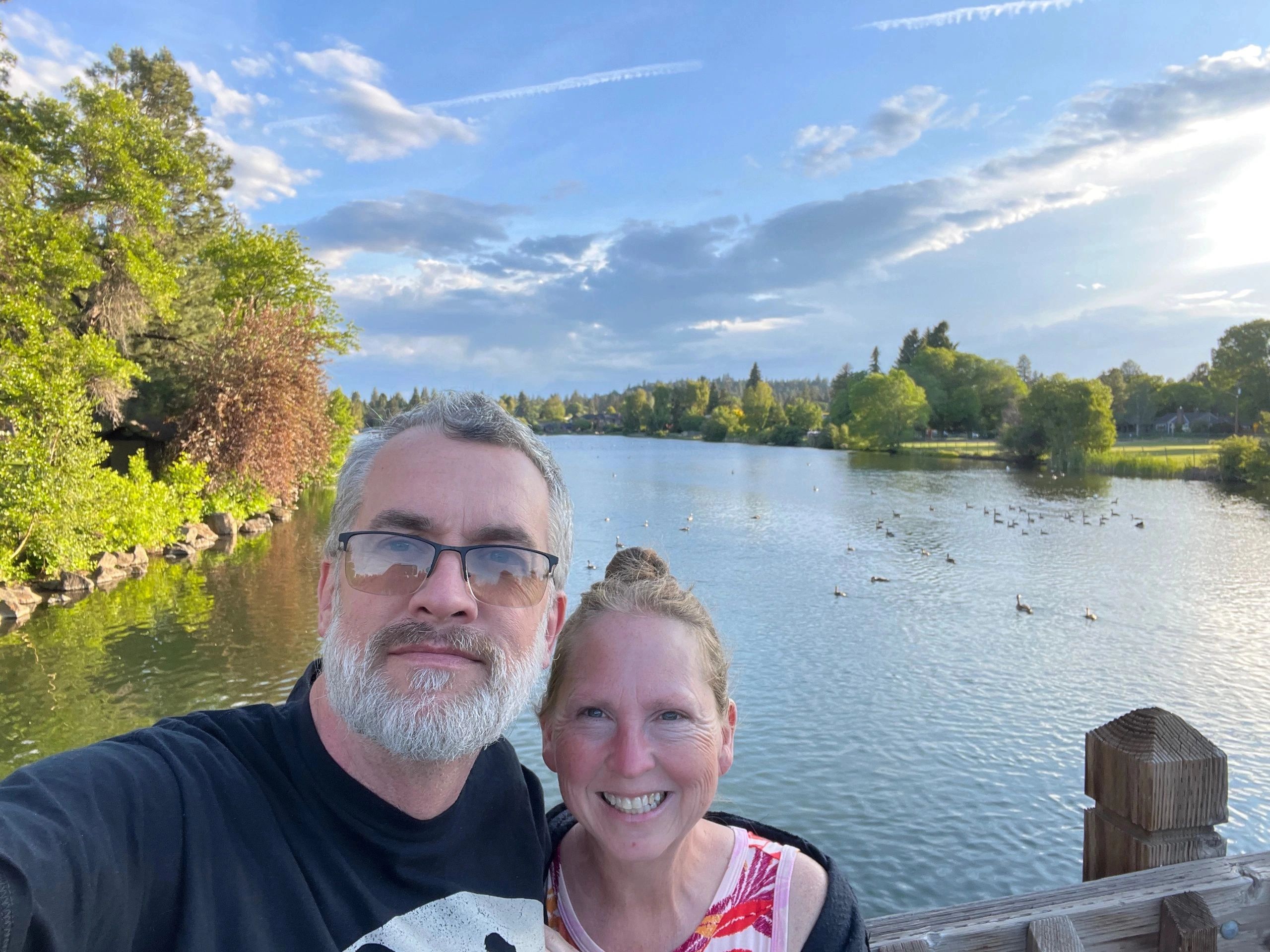 Jack and Ronita on a dock overlooking a scenic lake
